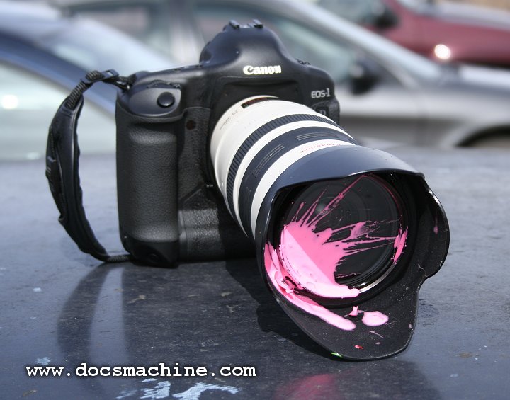 Splattered Canon camera and lens, 2006